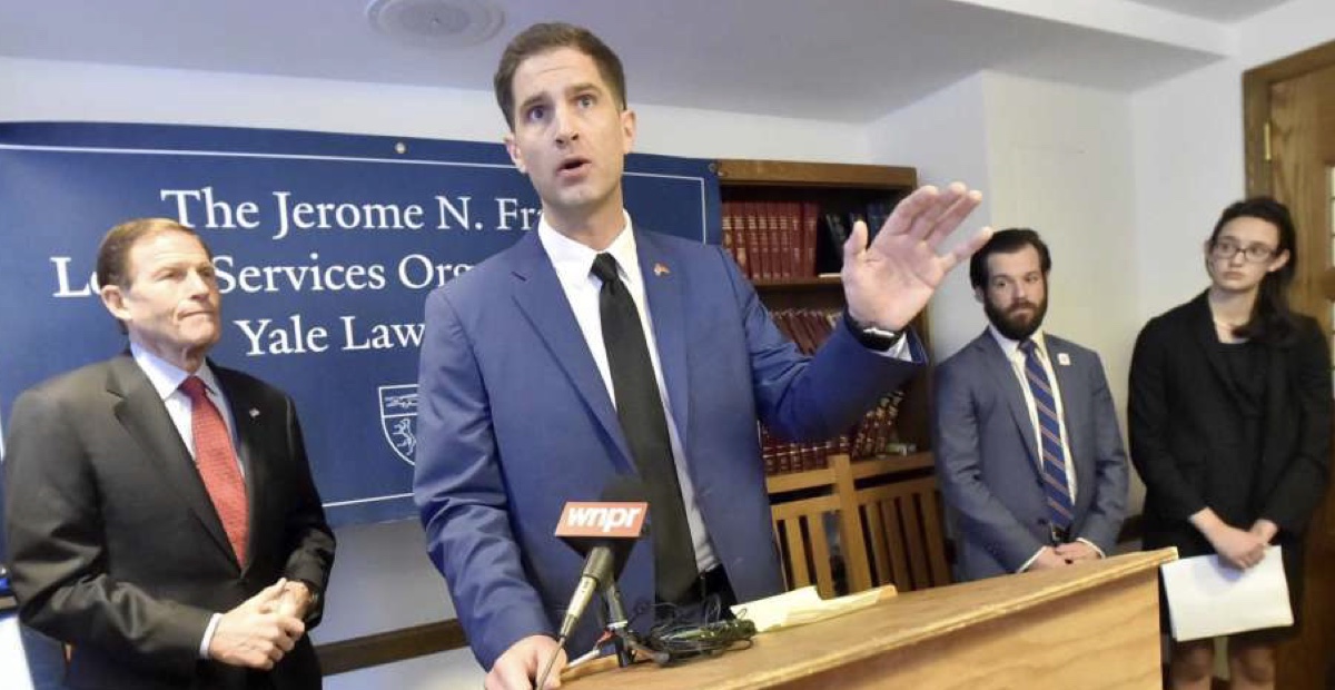 Tyson Manker speaking at a press conference at the Jerome N. Frank Legal Services Organization at Yale Law School